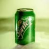 Shot of a Sprite can with mist effect showcasing refreshing qualities.